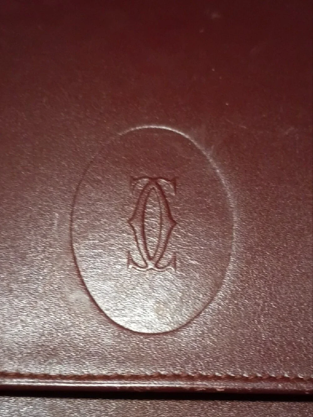 Cartier- Leather Fold-Over Clutch in Burgundy with Gold Accents